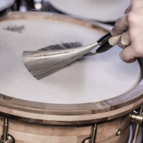 Brushes on snare drum demonstrating the brushes drum groove