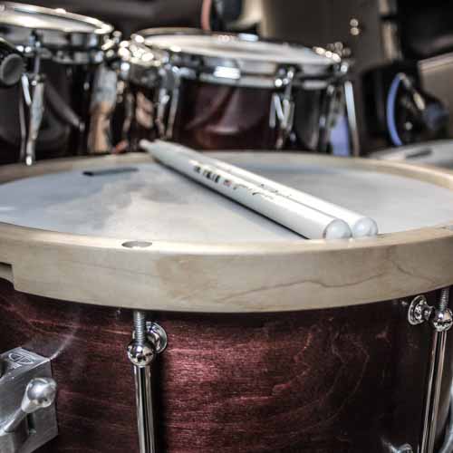 Custom red snare drum with wooden hoops that was used in this Country demo