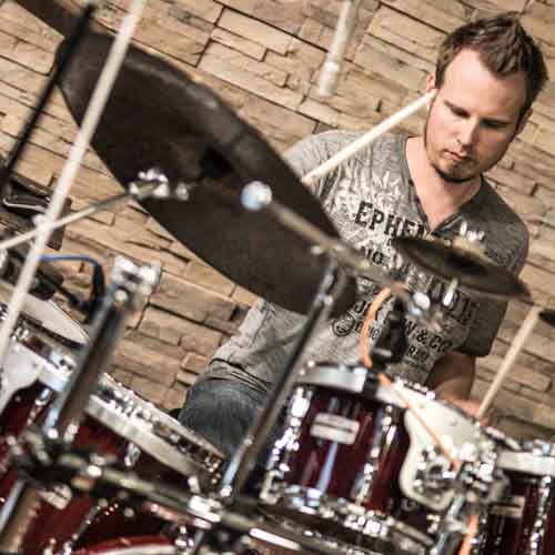 Professional session drummer playing fast Brazilian Samba groove